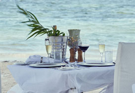 Romantic beachfront dining setup